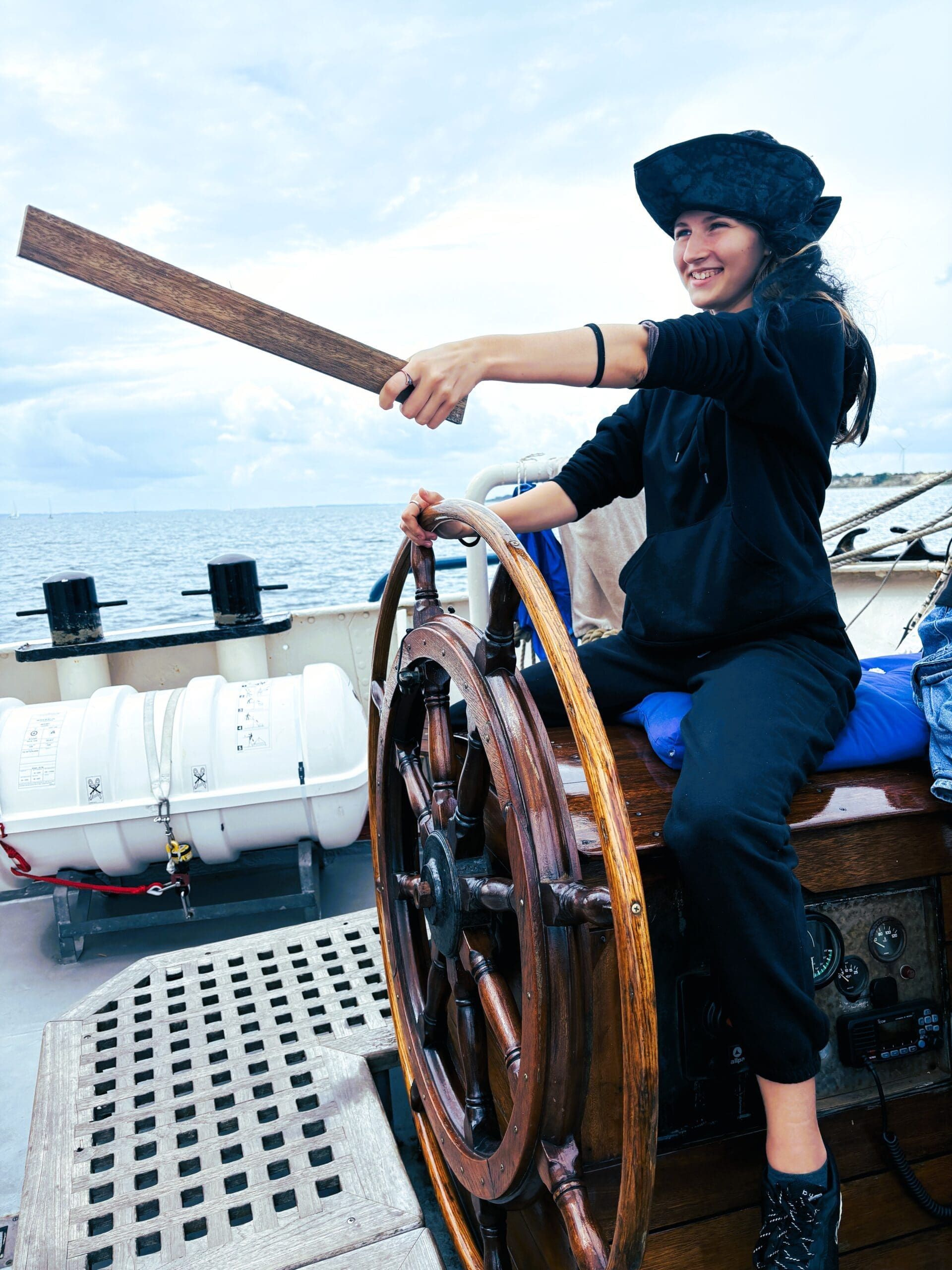 favourite teens- pirate on deck Teen girl having a laugh as a pirate at the helm